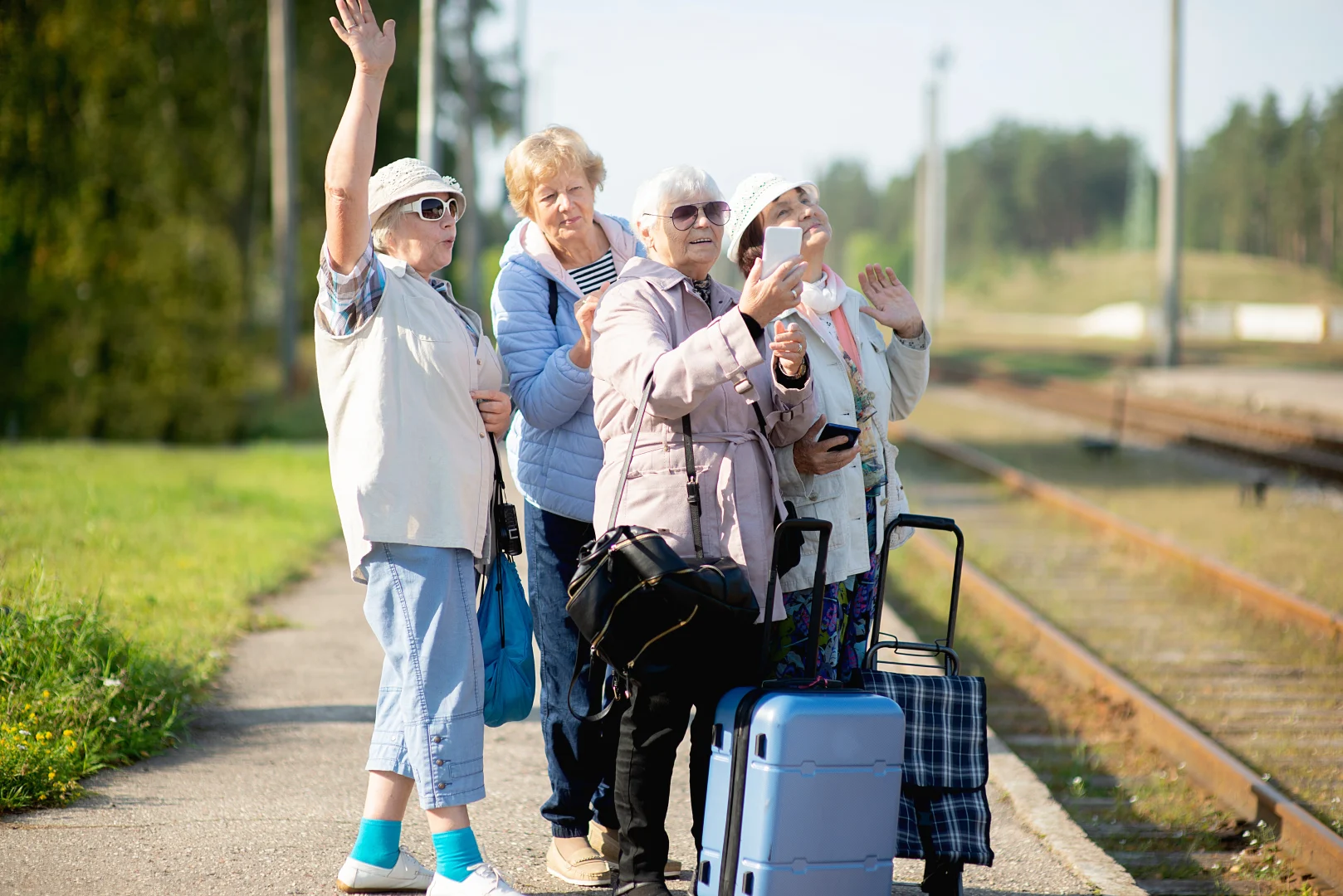 Group of senior women travelers taking a photo during their trip, an example of Baby Boomer tourism.